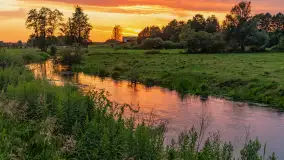 Zachód słońca nad rzeką Gołdapa w Baniach Mazurskich, lipiec 2025 r. - zdjęcie 10