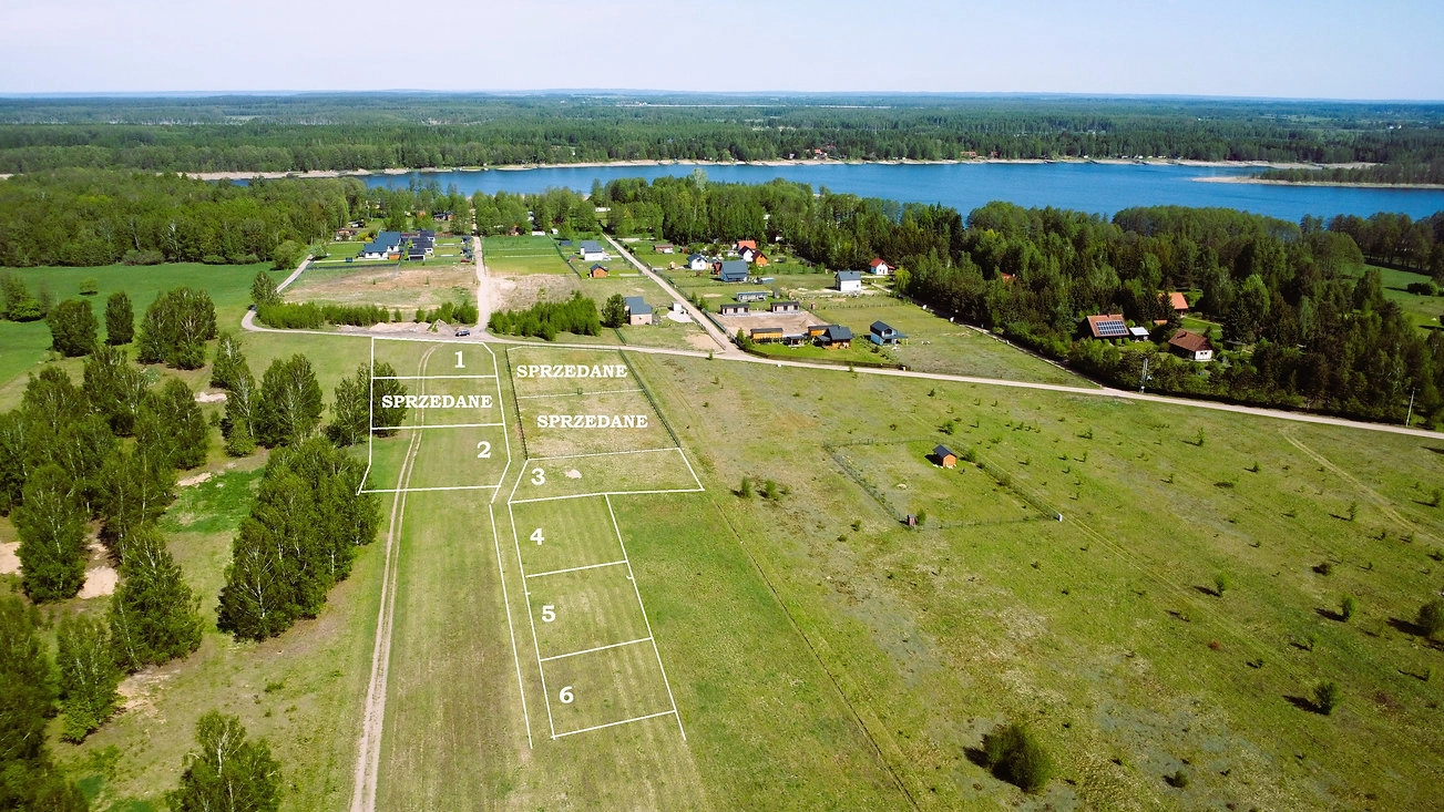 Pilchy -DZIAŁKI REKREACYJNE NAD JEZIOREM ROŚ warunki zabudowy budynek 66,75 m² pow zabudowy